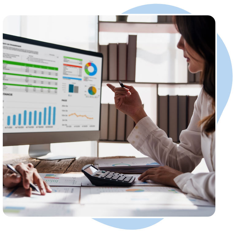 an executive looking at a business analytics on a monitor